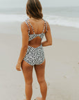 Cute modest one piece swimsuit, with ribbed texture and black and white cheetah print. Nursing Friendly