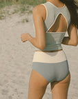 Blue high waisted swim bottoms.