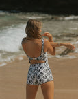 White and Black Floral Body Suit with Open back and gold clasp