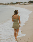 Feminine full coverage green floral swimsuit with swim skirt for spring