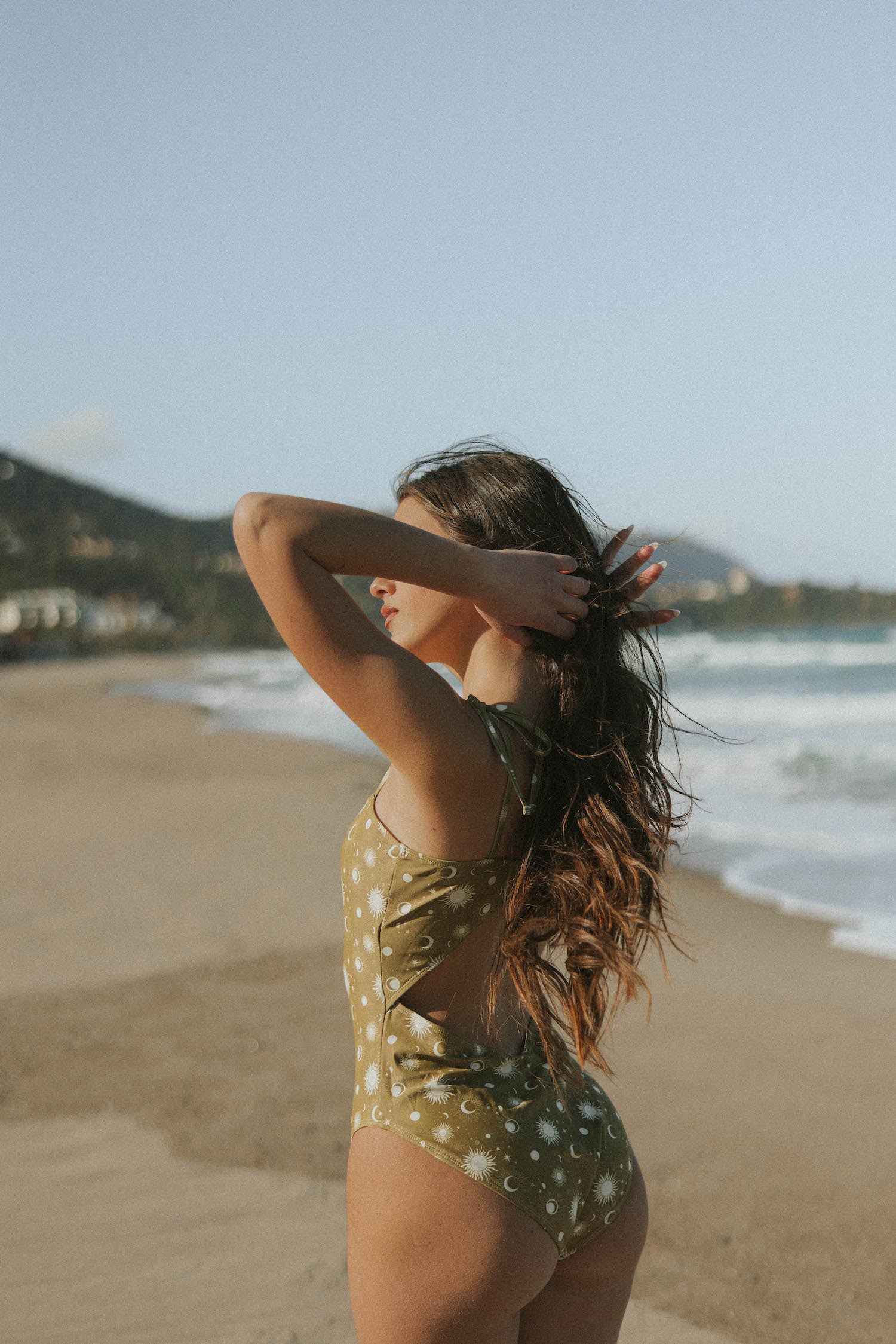 Modest one-piece swimsuit with open back and tying straps