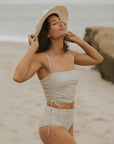 Full coverage gingham bikini top with adjustable ruching sides. 
