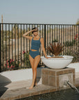 Modest teal tankini with textured material. 